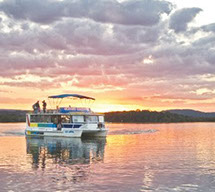 Cruise boat on Maroochy River at pink sunset